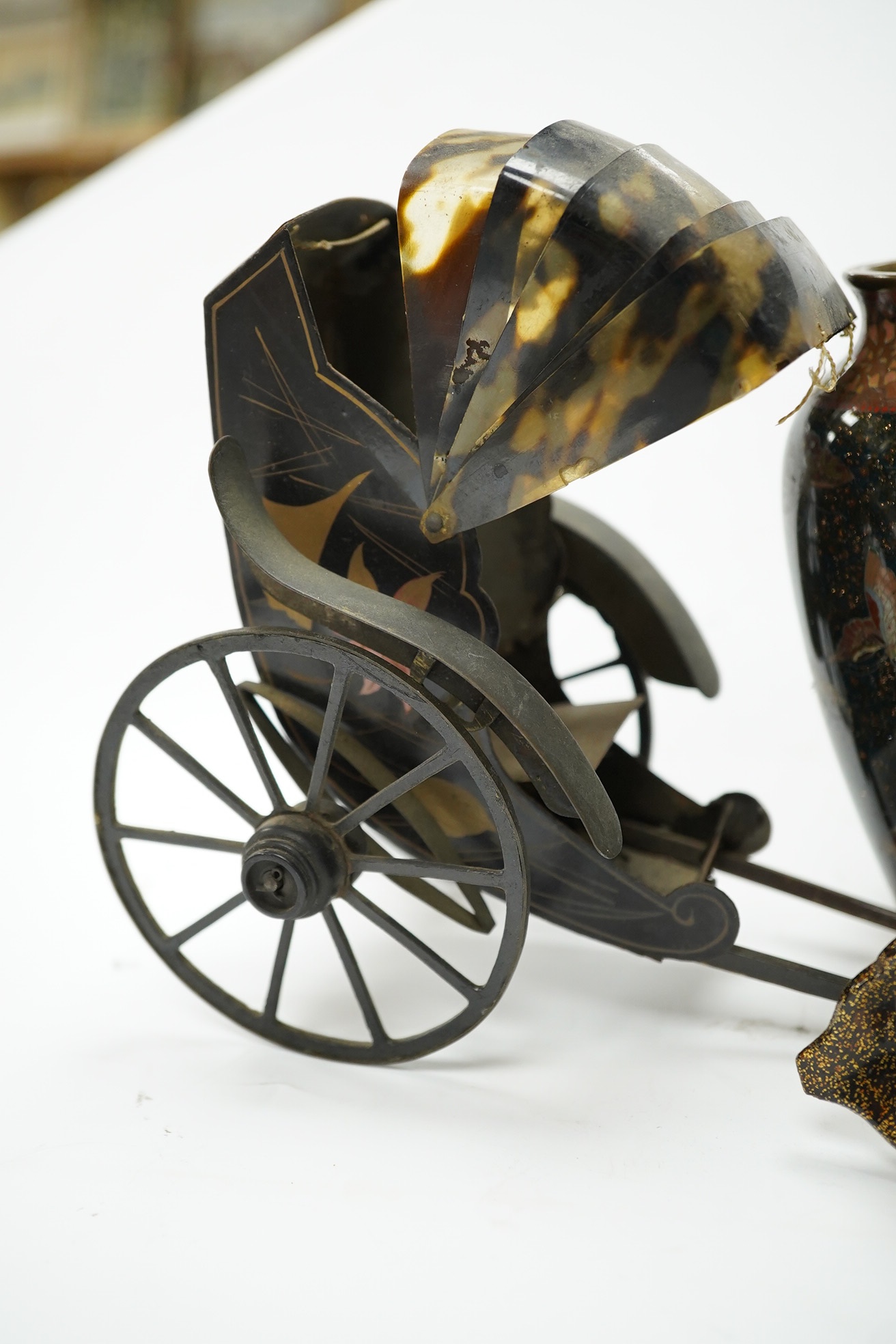 A damaged 19th century Japanese lacquer vase, a Japanese cloisonné enamel vase and a model tortoiseshell and lacquer rickshaw, rickshaw 20cm long., Condition - poor to fair